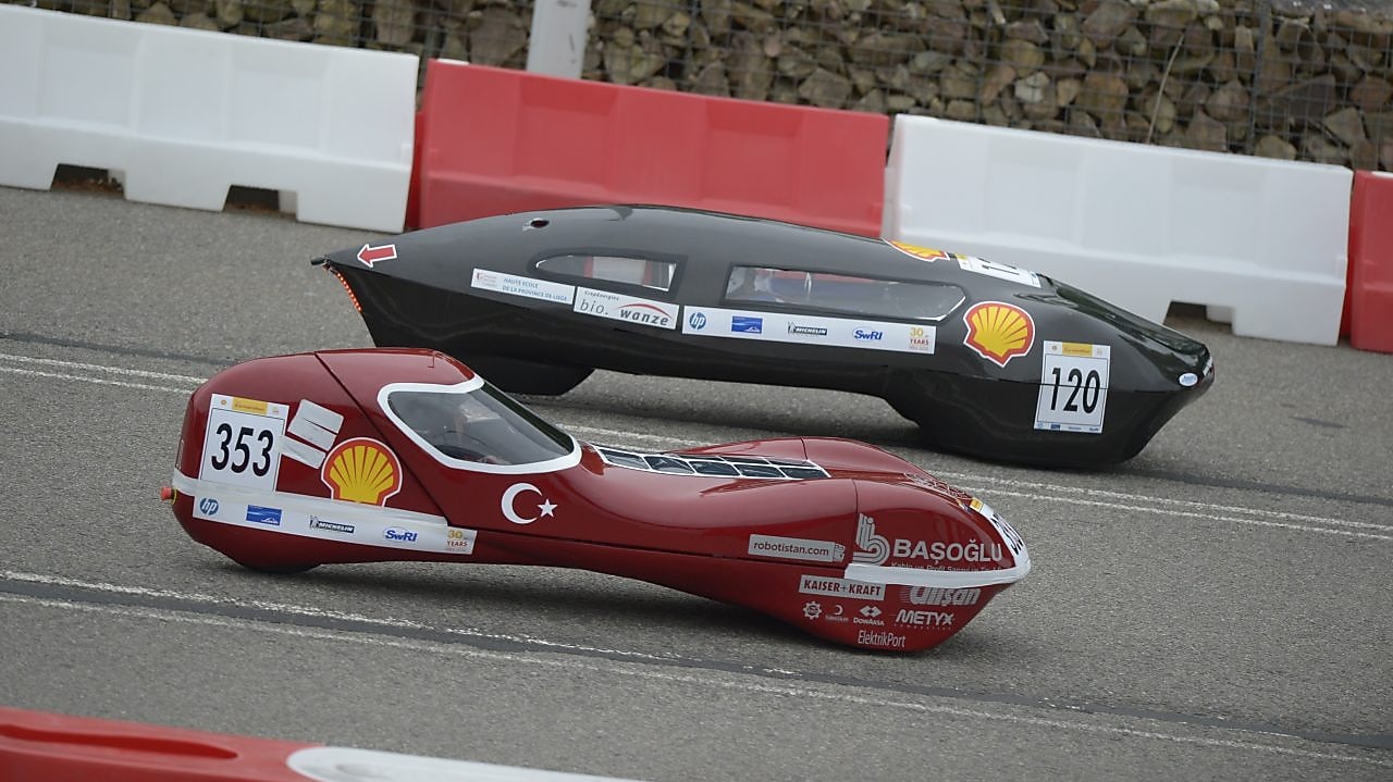 two racecars on track