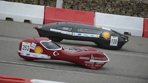 two racecars on track