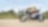 Bir adam taşra yolunda motosiklet kullanıyor