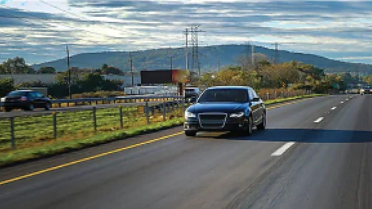 two black cars on road