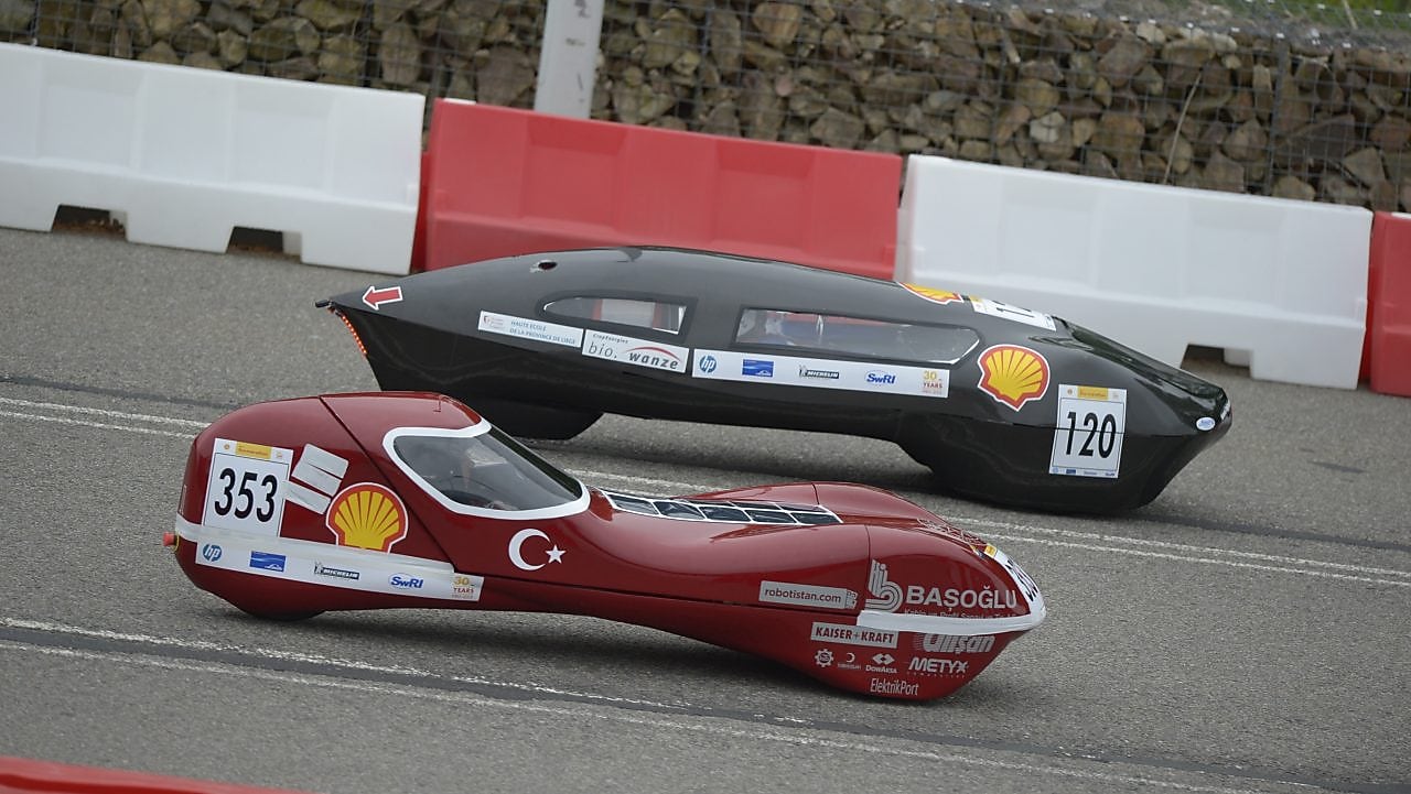 two racecars on track